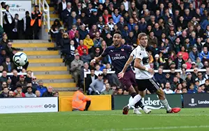 Fulham V Arsenal 2018-19 Prints: Aubameyang's Intense Goal: Arsenal's Fourth Amidst Fulham's Defensive Pressure