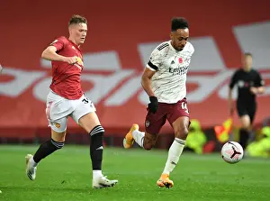 Manchester United V Arsenal 2020-21 Prints: Aubameyang's Sneaky Move: Outsmarting McTominay in Manchester United vs