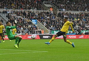 Images Dated 11th August 2019: Aubameyang's Stunner: Arsenal's Winning Goal vs. Newcastle United, Premier League 2019-20