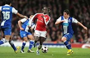 Images Dated 9th March 2010: Bacary Sagna (Arsenal) Cristian Rodriguez and Alvaro Pereira (Porto). Arsenal 5