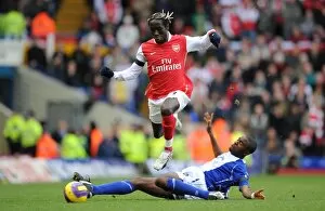 Images Dated 24th February 2008: Bacary Sagna (Arsenal) Fabrice Muamba (Birmingham City)