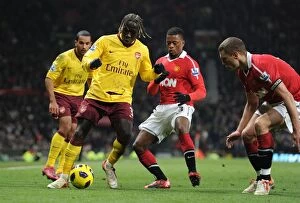 Images Dated 13th December 2010: Bacary Sagna (Arsenal) Patrice Evra and Nemanja Vidic (Man United). Manchester United 1