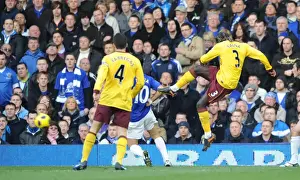 Everton V Arsenal 2010-11 Prints: Bacary Sagna shoots past Everton goalkeeper Tim Howard to score the first Arsenal goal