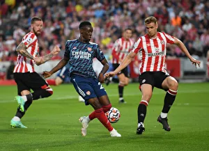 Backheel Battle: Flo Balogun vs. Kristoffer Ajer - A Premier League Showdown