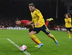 Battle at Bramall Lane: Sead Kolasinac vs. Chris Basham - A Defensive Showdown in Sheffield United vs. Arsenal FC, Premier League 2019-20