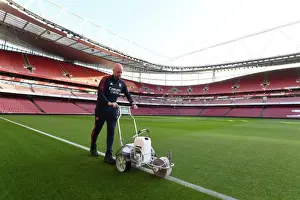 Battle Lines Drawn: Arsenal Groundsman Prepares Arsenal's Turf for the Big Match vs. Tottenham