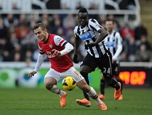 Newcastle United Collection: Battle in the Midfield: Jack Wilshere vs. Cheick Tiote (Premier League 2013-14)