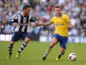 West Bromwich Albion V Arsenal 2013-14 Prints: Battle in the Midfield: Jack Wilshere vs Morgan Amalfitano (2013-14) - Arsenal vs West Bromwich Albion