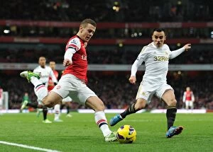 Arsenal v Swansea 2012-13 Collection: Battle for Midfield Supremacy: Jack Wilshere vs. Leon Britton (2012) - Arsenal vs. Swansea City
