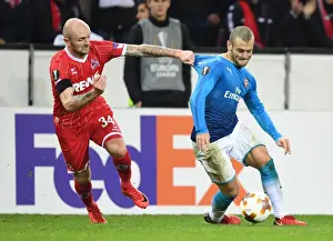 FC Koln V Arsenal 2017-18 Prints: Battle of Midfield: Wilshere vs. Rausch in Arsenal's Europa League Clash