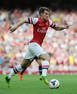 Spurs Prints: The Battle of North London: Arsenal's Aaron Ramsey Fights for Victory in the Arsenal vs