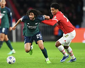 PSV Eindoven V Arsenal 2023-24 Prints: Battle for Possession: Mohamed Elneny vs