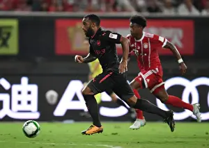 Battle in Shanghai: Lacazette vs. Alaba - Arsenal Forward's Duel with Bayern Munich Defender