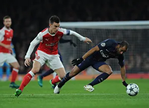 Arsenal V Paris Saint-Germain 2016-17 Prints: Battle of the Stars: Koscielny vs. Moura in Arsenal vs. Paris Saint-Germain UCL Clash