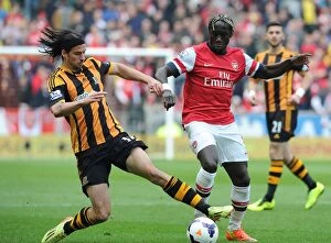Images Dated 20th April 2014: Battleground Bacary: Sagna Clashes with Boyd in Hull vs Arsenal Premier League Showdown