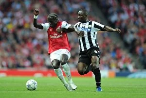 Arsenal v Udinese 2011-12 Collection: Battleground Emirates: Sagna Holds Off Armero in Arsenal's UEFA Champions League Clash (2011)