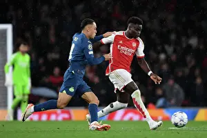 Battling Wings: Saka vs. Dest in Arsenal's Champions League Clash