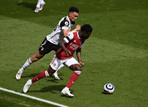 Battling Wings: Saka vs. Robinson in an Empty Emirates Showdown - Arsenal vs. Fulham, 2021