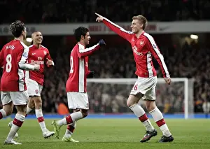Vela Carlos Prints: Bendtner and Vela's Double Celebration: Arsenal's Unforgettable 4-0 FA Cup Victory Over Cardiff City