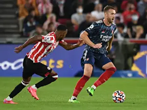 Brentford vs Arsenal: Calum Chambers Clashes with Rico Henry in Premier League Showdown