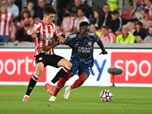 Brentford vs Arsenal: Intense Clash between Flo Balogun and Christian Norgaard in the 2021-22 Premier League