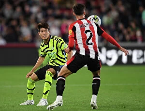Images Dated 28th September 2023: Brentford vs Arsenal: Tomiyasu Closes In on Hickey in Carabao Cup Clash
