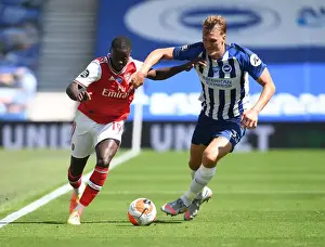 Brighton And Hove Albion V Arsenal 2019-20 Prints: Brighton vs. Arsenal: Pepe Takes on Burn in Empty Premier League Clash (2019-20)