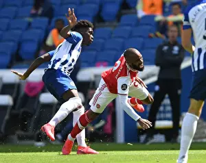 Brighton And Hove Albion V Arsenal 2019-20 Prints: Brighton vs. Arsenal: Empty Stadium Clash - Lacazette Fouls Bissouma