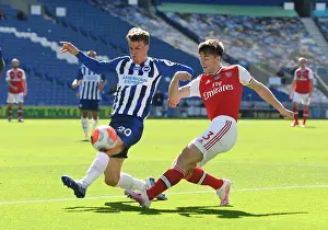 Brighton And Hove Albion V Arsenal 2019-20 Prints: Brighton vs Arsenal: Empty Stadium Showdown - Kieran Tierney Clashes with Solly March (Premier League)