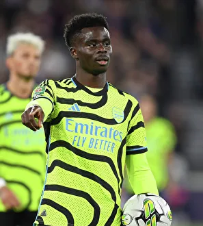 West Ham United V Arsenal - Carabao Cup 2023-24 Prints: Bukayo Saka in Action: Arsenal vs. West Ham United - Carabao Cup 2023-24