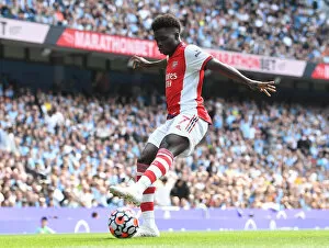 Images Dated 28th August 2021: Bukayo Saka in Action: Manchester City vs. Arsenal, Premier League 2021-22