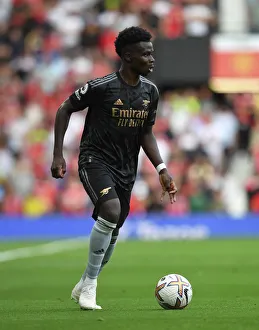 Bukayo Saka in Action: A Riveting Manchester United vs. Arsenal Moment, Premier League 2022-23