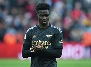 Liverpool v Arsenal 2022-23 Collection: Bukayo Saka Applauds Arsenal Fans at Anfield After Liverpool Clash (2022-23)