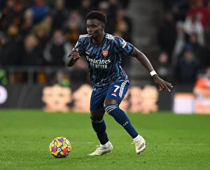 Images Dated 10th February 2022: Bukayo Saka: Arsenal Star Shines in Premier League Clash Against Wolverhampton Wanderers