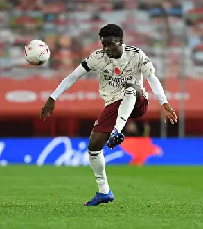 Bukayo Saka: Arsenal's Radiant Star Shines at Old Trafford Amidst Empty Seats, Manchester United vs. Arsenal, 2020-21 Premier League