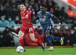 Bukayo Saka Closes In on Robertson: Intense Moment from Carabao Cup Semi-Final First Leg between Liverpool and Arsenal