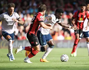 Bukayo Saka Faces Off Against Ben Pearson: AFC Bournemouth vs Arsenal FC, 2022-23 Premier League
