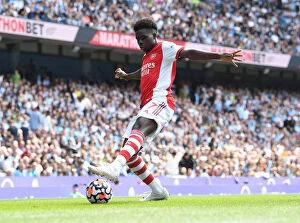 Images Dated 28th August 2021: Bukayo Saka Faces Off Against Manchester City: Premier League Clash