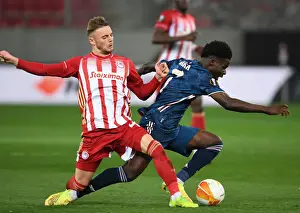 Bukayo Saka Faces Off Against Oleg Reabciuk in Empty Karaiskakis Stadium: Olympiacos vs. Arsenal, UEFA Europa League Round of 16