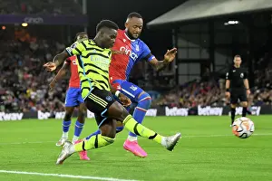 Bukayo Saka Faces Pressure from Jordan Ayew in Crystal Palace vs Arsenal Premier League Clash (2023-24)