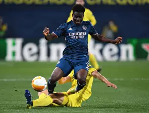 Villarreal V Arsenal 2020-21 Prints: Bukayo Saka Fouls by Pau Torres in Villarreal v Arsenal UEFA Europa League Semi-Final