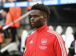 Newcastle United V Arsenal 2022-23 Prints: Bukayo Saka Gears Up: Arsenal vs Newcastle United, Premier League 2022-23