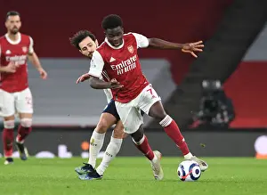 Bukayo Saka Outsmarts Bernardo Silva: A Standout Moment at Empty Emirates Stadium
