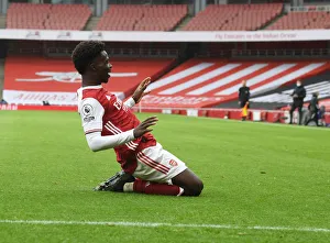 Bukayo Saka Scores First Goal in Empty Emirates: Arsenal's Historic Victory over Sheffield United in the 2020-21 Premier League