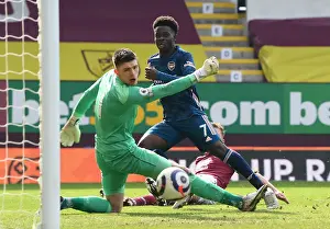 Bukayo Saka Takes a Shot Amidst Burnley's Defense in Empty Turf Moor - Arsenal vs Burnley, Premier League 2020-21