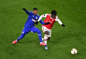 Arsenal V Olympiacos 2019-20 Prints: Bukayo Saka vs Bruno Gaspar: Intense Europa League Showdown at Arsenal's Emirates Stadium