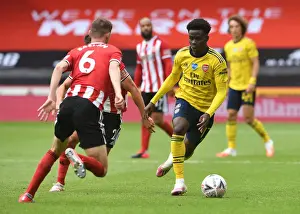 Bukayo Saka vs. Chris Basham: FA Cup Quarterfinal Showdown - Sheffield United vs. Arsenal