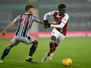 West Bromwich Albion V Arsenal 2020-21 Prints: Bukayo Saka vs. Dara O'Shea: Clash at The Hawthorns - Arsenal vs