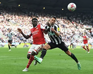 Newcastle United V Arsenal 2022-23 Prints: Bukayo Saka vs Fabian Schar: Intense Battle at St