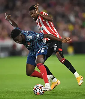 Brentford V Arsenal 2021-22 Prints: Bukayo Saka vs. Frank Onyeka: Clash at Brentford Community Stadium - Arsenal vs